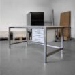 Work table with layette and triple drawer